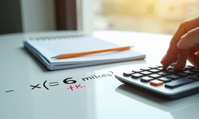 Calculatrice moderne avec crayon sur bureau blanc conversion miles en km